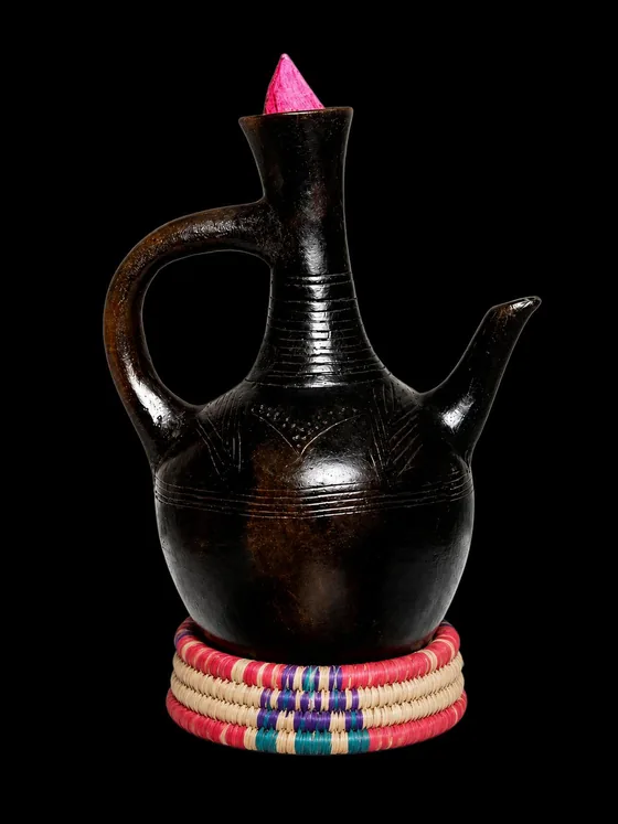Black glazed Ethiopian jebena on a woven ring