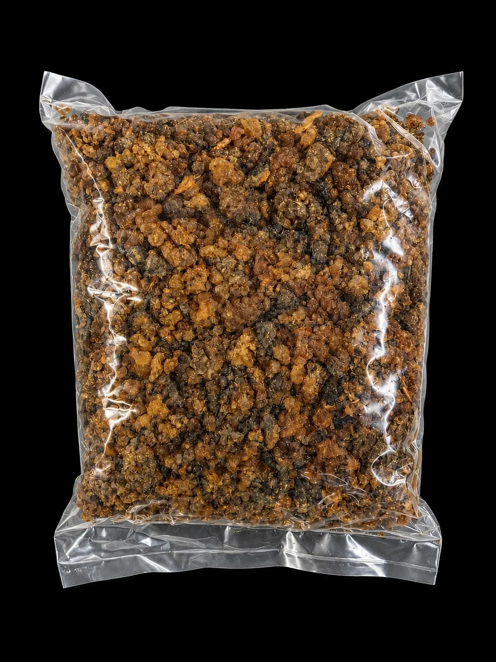Bag of amber and dark myrrh incense resin granules