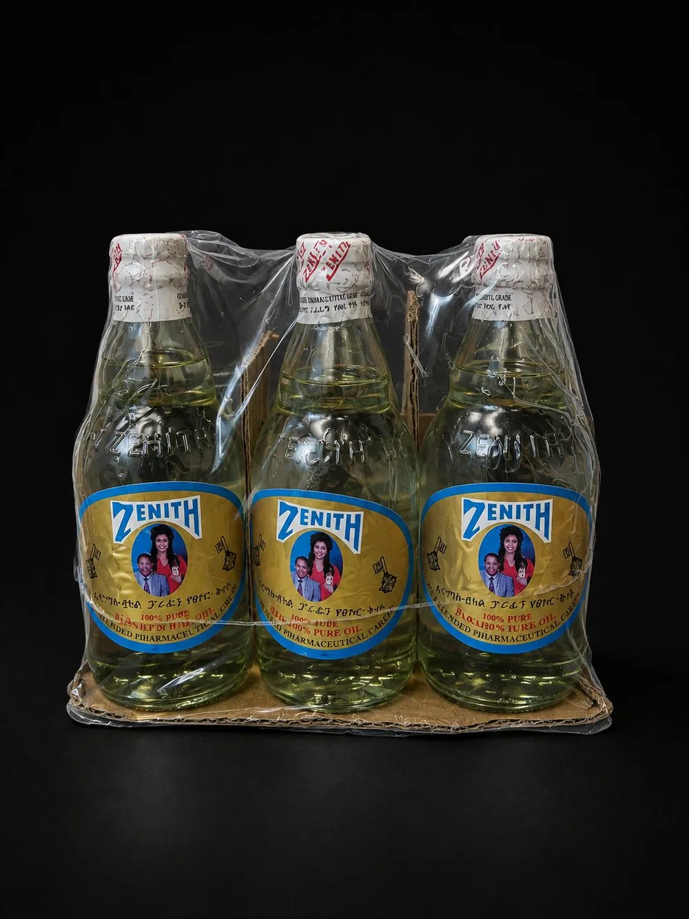 Shrink-wrapped six-pack of Zenith pure cooking oil bottles