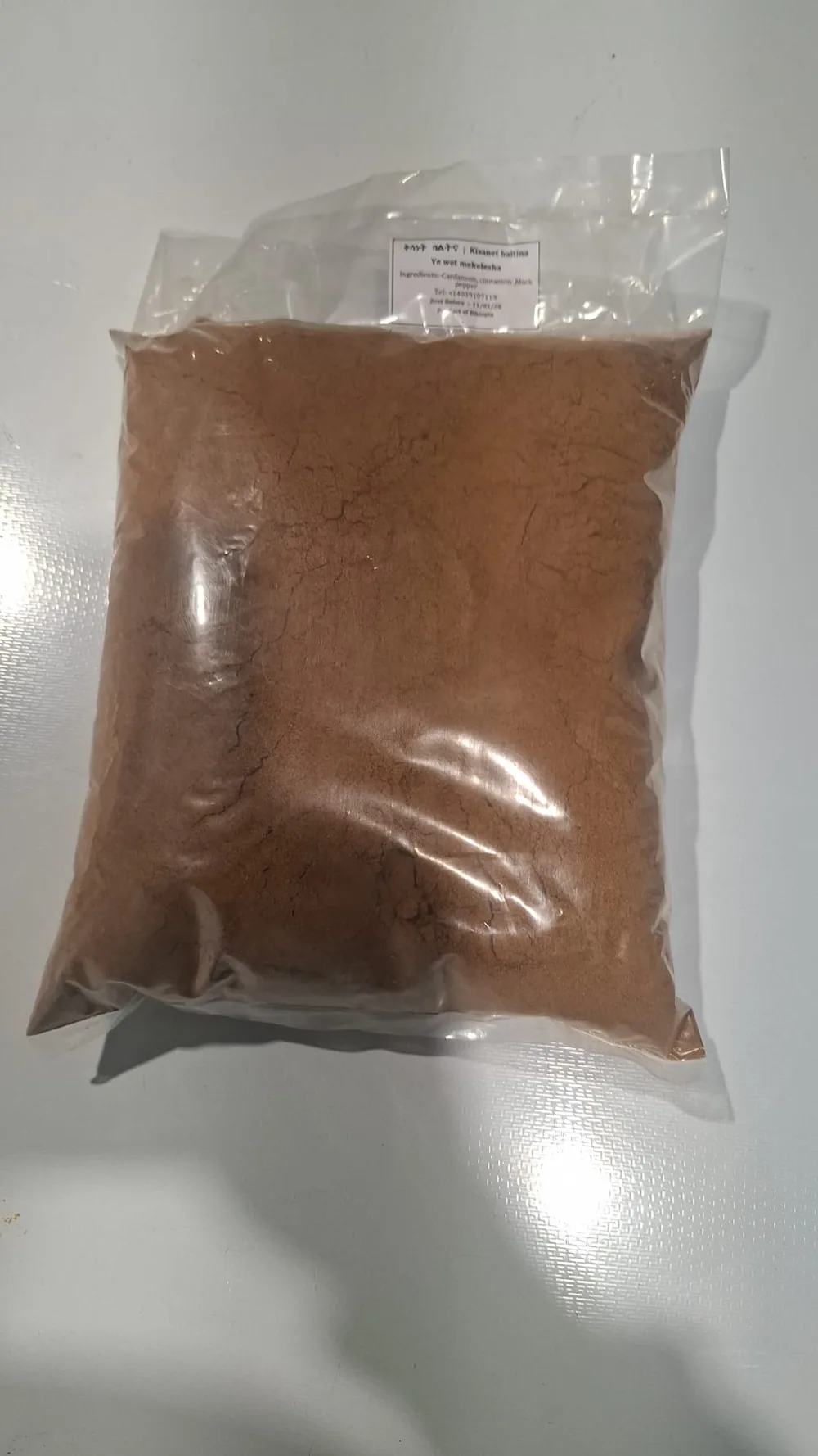 Sealed 1 kg bag of Berbere pepper powder, Kisanet Baltina label